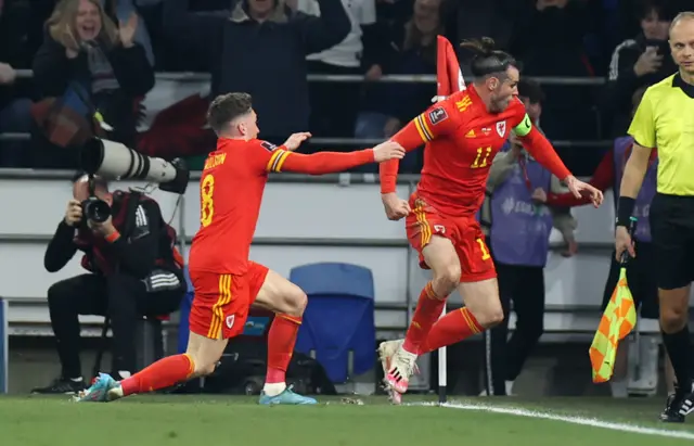 Gareth Bale celebrates with Harry Wilson