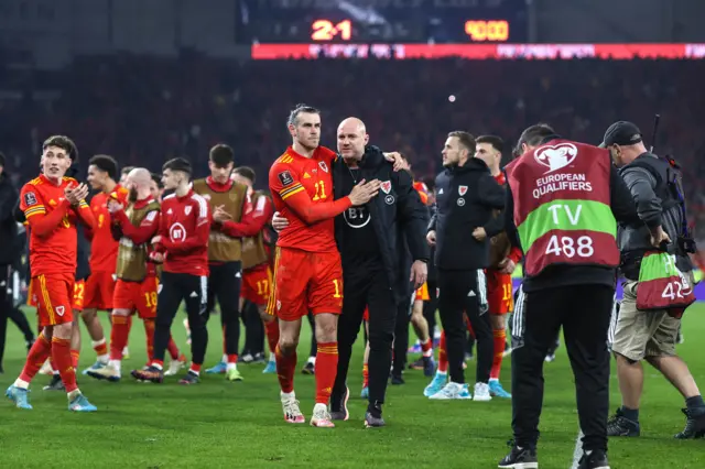 Robert Page celebrates with Gareth Bale