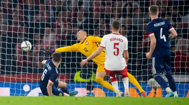 Kieran Tierney watches as his header flies into the net