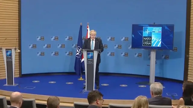 Boris Johnson giving press conference at Nato summit