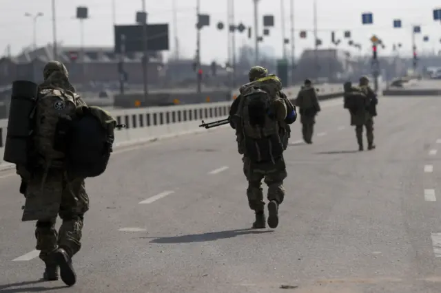 Ukrainian soldiers patrolling near Kyiv