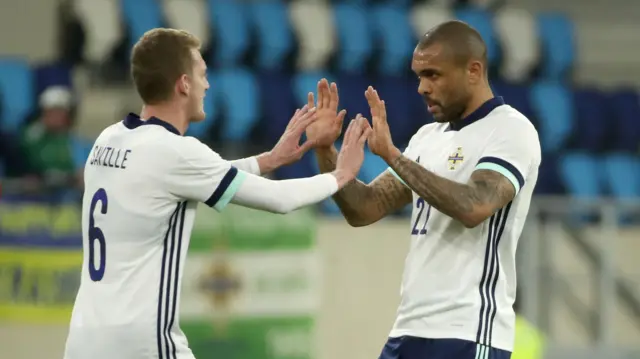 George Saville congratulates NI goalscorer Josh Magennis