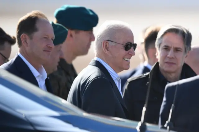 US president Joe Biden (C) and US Secretary of State Antony Blinken (R) arrive at the airport near Rzeszow, Poland