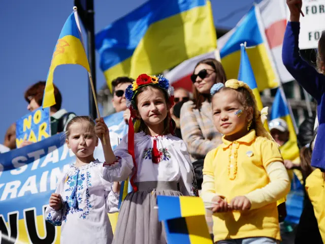 Children with Ukrainian flags at the march in London