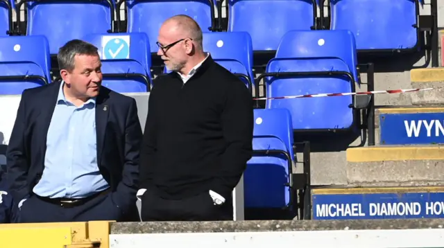 Respective managers Billy Dodds and John Hughes exchange pleasantries prior to kick-off