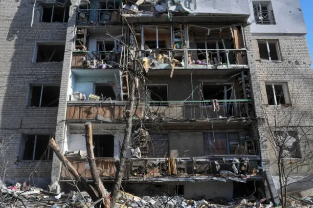 A destroyed residential building in Kharkiv