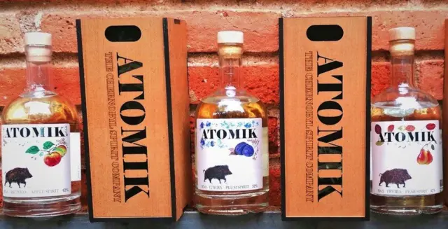 Three bottles of Atomik Chernobyl fruit spirit