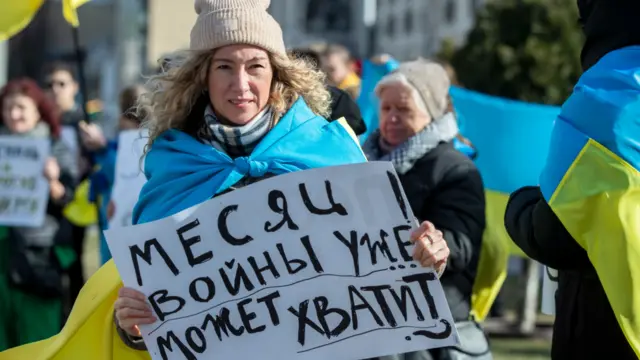 Protesters against the Ukraine war gather outside the Russian Embassy in Chisinau, Moldova