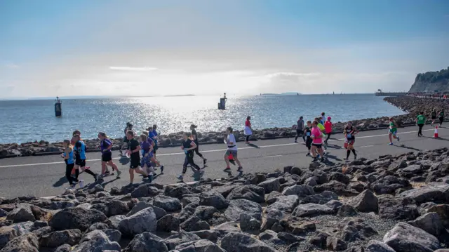 Runners along Cardiff Bay