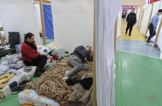 Refugees sleeping in a gym in Lviv