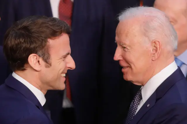 Emmanuel Macron and Joe Biden speak at a Nato summit in Brussels on Thursday