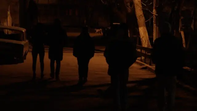 Elderly people are among patrols at night, asking to check the documents of people they encounter