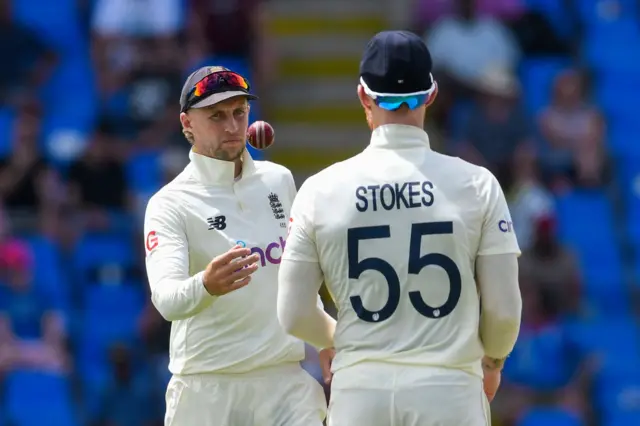 Joe Root throws the ball to Ben Stokes