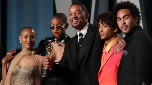 Will Smith holds his Oscar in photographs with his wife Jada Pinkett Smith (L), daughter Willow Smith (2nd L), son Jaden Smith (2nd R) and son Trey Smith (R)