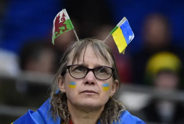 Wales fan with a flag in support of Ukraine