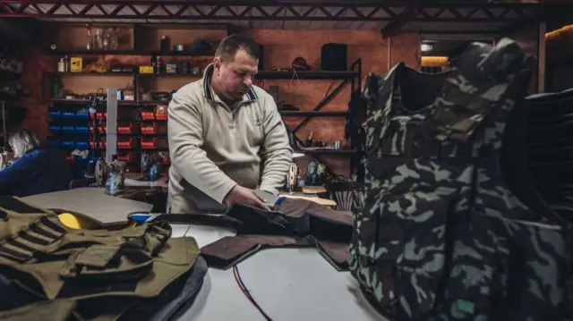 A volunteer fills a bulletproof vest with foam in Zaporizhzhia, Ukraine on March 28, 2022.