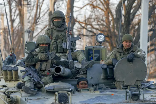 Russian soldiers are seen on a tank in Volnovakha district in the pro-Russian separatists-controlled Donetsk, in Ukraine on March 26, 2022.