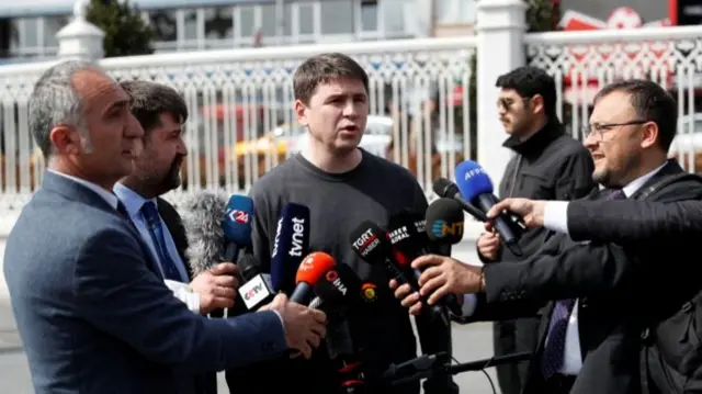 Mykhailo Podolyak, a political adviser to Ukrainian President Zelenskiy, receives questions from the media