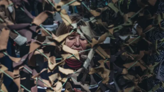 Volunteers weaving camouflage nets in Zaporizhzhia, Ukraine on March 28, 2022.