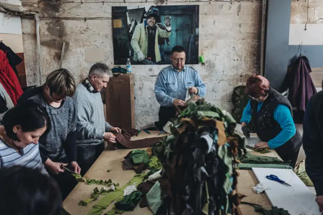 Volunteers weave camouflage nets in Zaporizhzhia, Ukraine on March 28, 2022