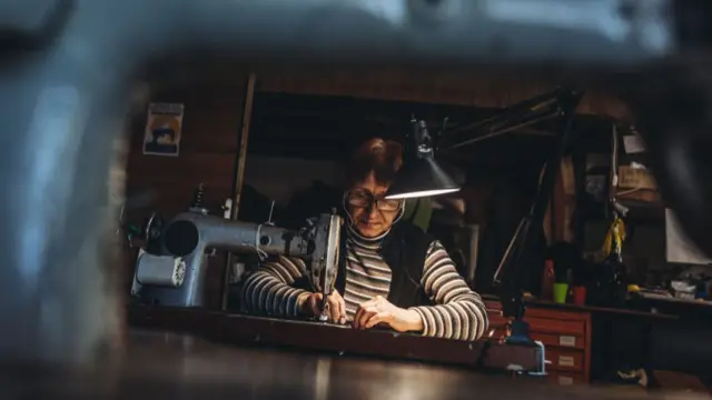 A volunteer sews a bulletproof vest in Zaporizhzhia, Ukraine on March 28, 2022.