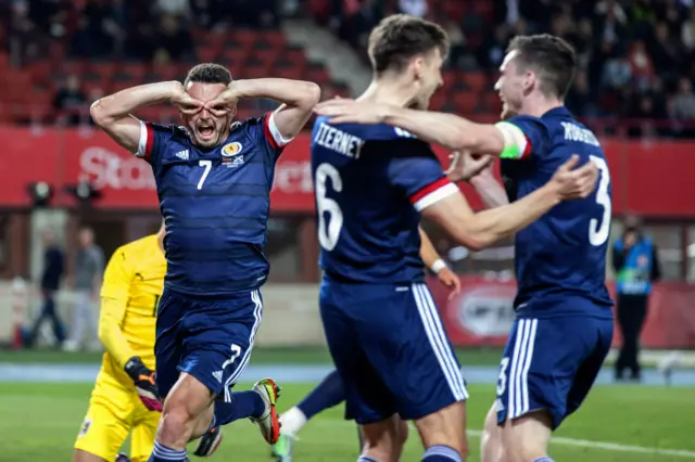 John McGinn celebrates thumping Scotland into a 2-0 lead