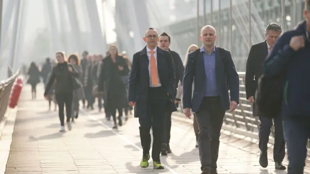 Commuters crossing the Golden Jubilee Bridge in London during the strike