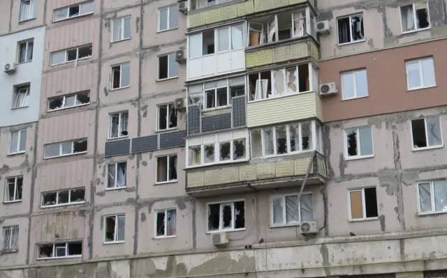 Damaged apartment block in Mariupol