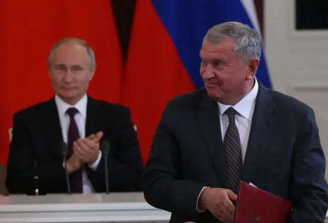 Igor Sechin is watched on by Vladimir Putin during Russia-China talks