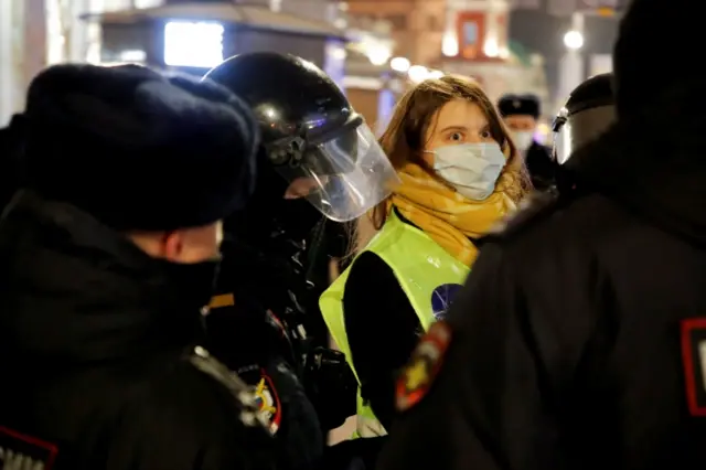Russian law enforcement officers detain a person wearing a press symbol during an anti-war protest against Russia"s invasion of Ukraine, in Saint Petersburg, Russia March 2, 2022.