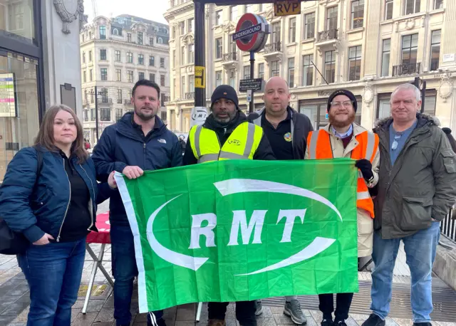 RMT union member Daniel Randall (second right) on the picket line at Oxford Circus Tube station