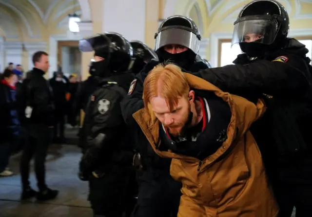 Russian law enforcement officers detain a demonstrator during an anti-war protest against Russia"s invasion of Ukraine, in Saint Petersburg, Russia March 2, 2022.