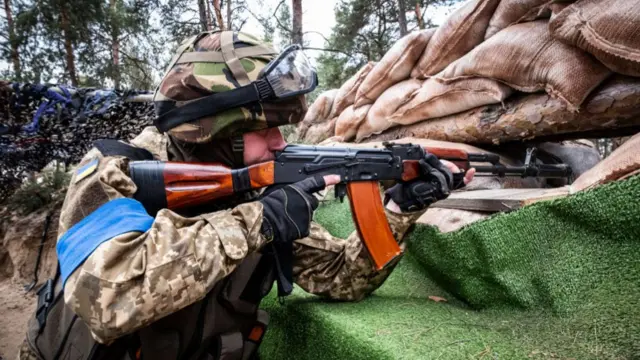 A soldier in an advanced position on the outskirts of Kyiv