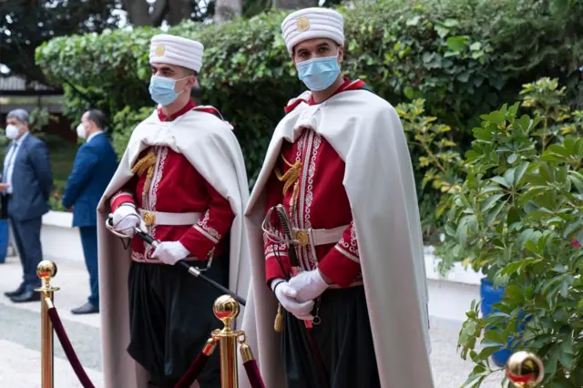 Algerian guards with masks on