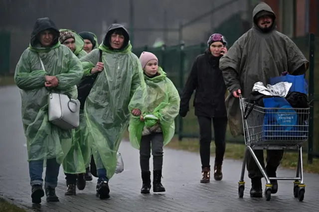 Refugees and volunteers at the Medyka border crossing rom Ukraine into Poland