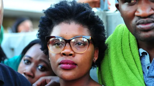 Sibongile Mani is seen fleeing a media conference from angry students demanding that she pays back the National Student Financial Aid Scheme (NSFAS) money on September 04, 2017