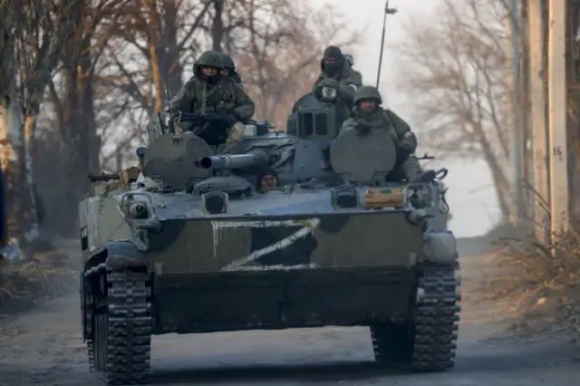 Russian soldiers are seen on a tank in Volnovakha district in the pro-Russian separatists-controlled Donetsk