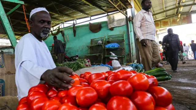 Tomato seller in Khartoum, Sudan - Thursday 31 March 2022