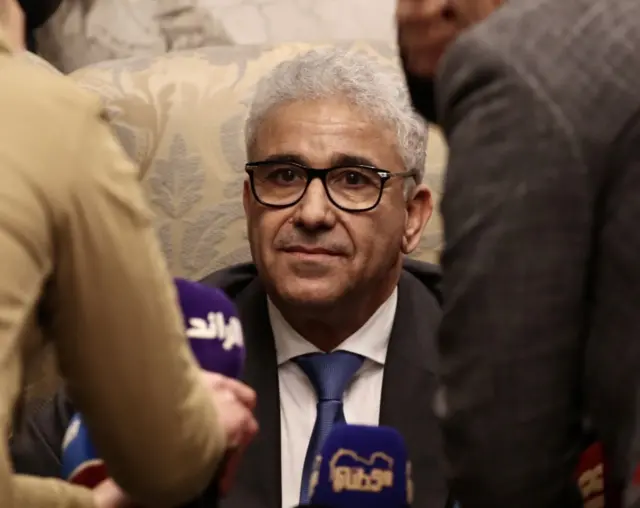 Fathi Bashaga at a press conference in Tripoli.