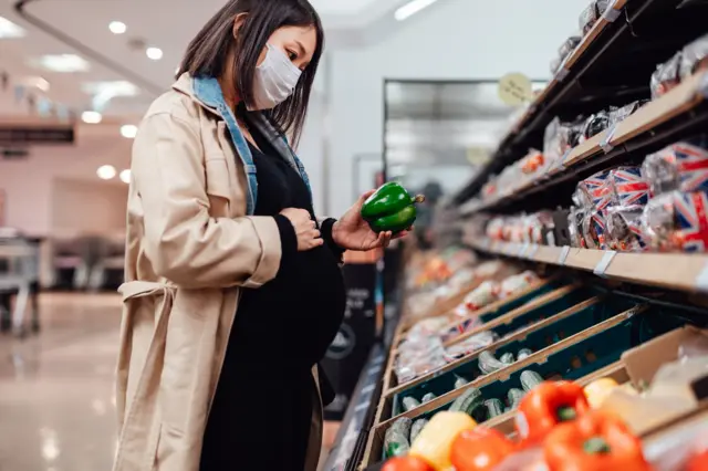 woman wearing mask in supermarket