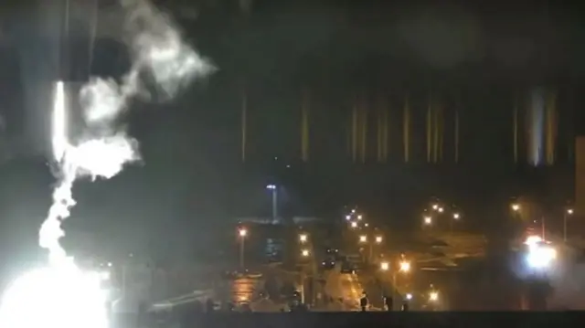 Surveillance camera footage shows a flare landing at the Zaporizhzhia nuclear power plant during shelling in Enerhodar, Zaporizhia Oblast, Ukraine March 4, 2022,