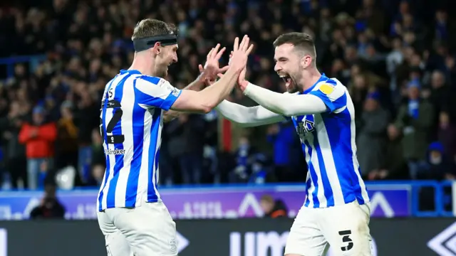 Tom Lees celebrates