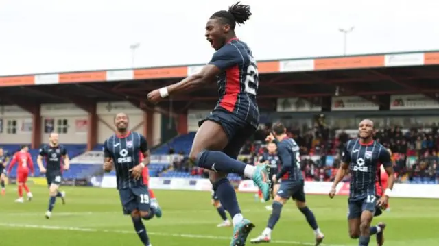 Joseph Hungbo celebrates his penalty