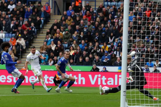 Jack Harrison's shot is saved by Kasper Schmeichel