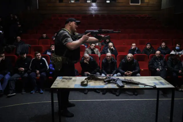 Civilians learn to use AK47 rifles in a cinema at the Lviv Film Center on 5 March 2022 in Lviv, Ukraine