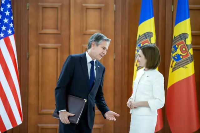 US Secretary of State Antony Blinken (L) speaks with President of Moldova Maia Sandu after their meeting in the presidential palace during his official visit in Chisinau