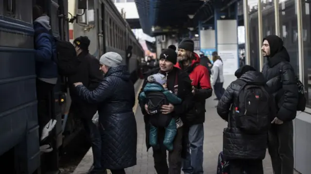 People boarding a train at Kyiv train station, Ukraine