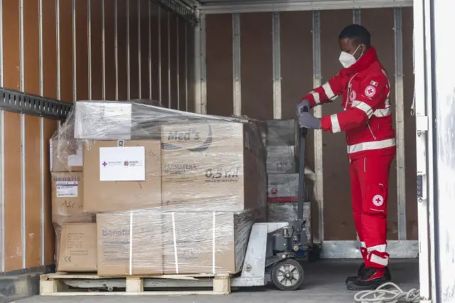 Members of the Italian Red Cross (IRC) collect medicines to be distributed to the Ukrainian population