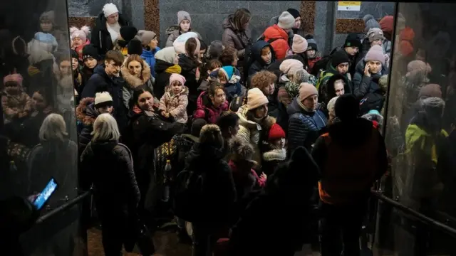 Women and children queue at Lviv station