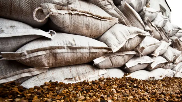 Stock image of sand bags piled up